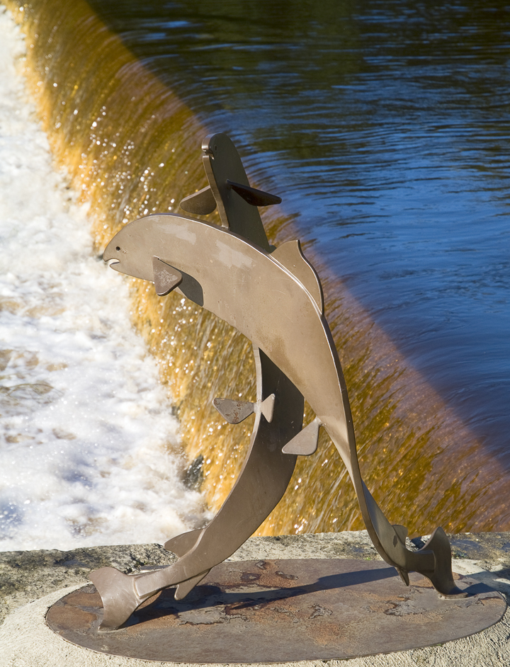 Wetherby; 'leaping salmon' sculpture by the weir across the River Wharfe.